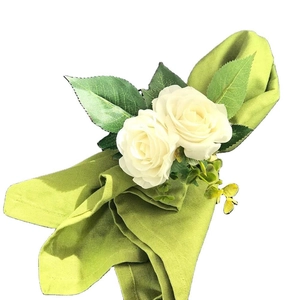 White rose flower napkin ring with green leaves for wedding table decoration