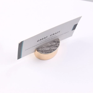 Macro shot of semi-circle natural agate business card holder with gold metal base