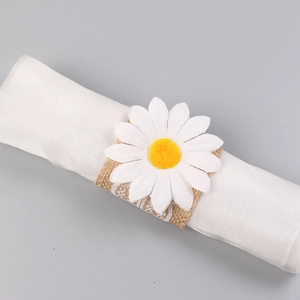 Detailed view of rustic burlap napkin ring with white lace and daisy floral decoration