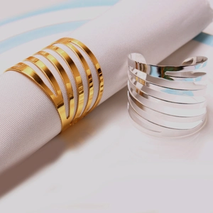 Minimalist gold and silver striped napkin rings with polished multi-layer hollow design