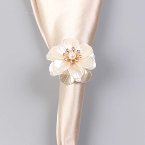 European pearl flower napkin ring with acrylic petals and rhinestones on satin fabric