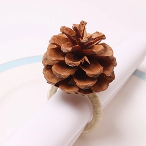 Natural pine cone napkin ring with woven rope holder for rustic Christmas table setting