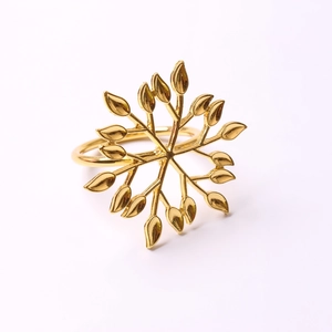 Polished gold leaf napkin ring made of premium metal for festive table decoration