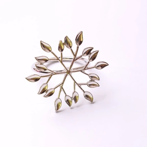 Polished silver snowflake napkin ring with radial leaf design for Christmas table setting