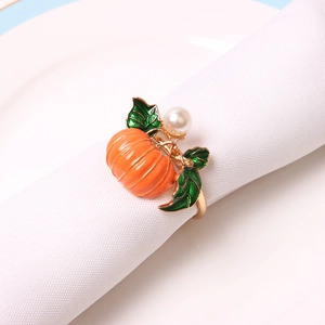 Golden pumpkin napkin ring with orange enamel leaf and white pearl for harvest table decor