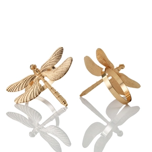 Elegant gold dragonfly napkin rings for party table decor featuring detailed metal wings