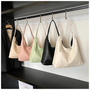 Detailed row of tote bags showing litchi grain texture in five various colors