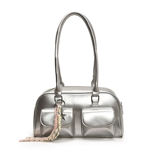 Silver metallic Y2K shoulder bag with dual front pockets and star charm detail