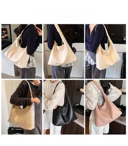 Detail view of large lychee texture hobo bags in cream, khaki, black and pink colors