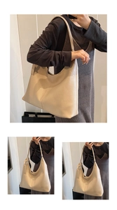 Detailed macro view of beige lychee grain leather texture on high-capacity bucket bag