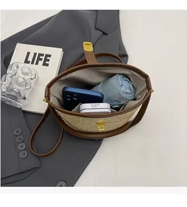Top view of woven straw bucket bag interior showing spacious capacity for daily essentials