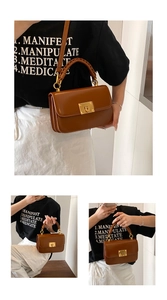 Detail of retro brown square bag featuring woven handle and gold-tone twist lock closure