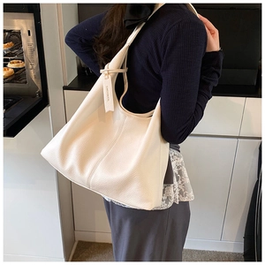 Detailed view of white lychee grain tote bag showing texture and large capacity fit