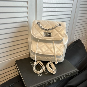 White quilted faux leather backpack with silver chain detail and classic diamond pattern