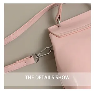 Close-up of durable silver metal swivel hook and pink leather strap on handbag