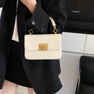 Elegant cream leather rectangular handbag with gold metal lock and woven handle for women