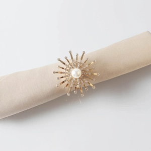 Golden sunburst napkin ring with centered pearl and sparkling crystals for wedding decor