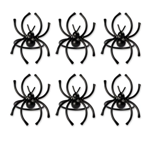 Detailed view of six black spider napkin rings for Halloween table decor setting