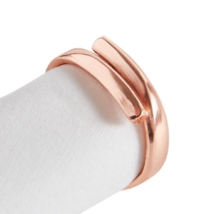 Elegant rose gold plated napkin ring with a brushed metal finish and double wrap design