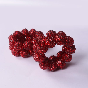 Pair of sparkling red beaded napkin rings with rhinestones for Christmas table setting