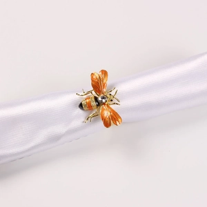 Exquisite gold-plated honey bee napkin ring with vibrant orange enamel and crystal detail