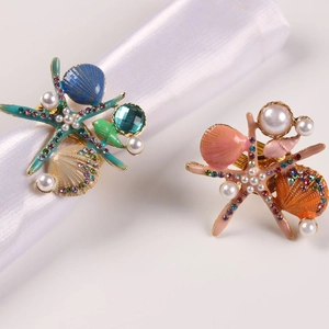 Ronds de serviette marins avec étoile de mer et coquillage, émail et perles