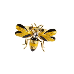Bee napkin ring with yellow enamel wings and sparkling gemstone on a golden metal base