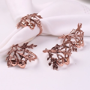 Set of four bronze pinecone napkin rings with realistic oak leaf and acorn metal details