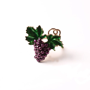 Elegant purple grape napkin ring with green leaves for dining table decor and hotel use