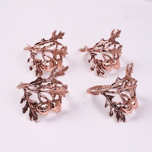Set of 4 rose gold oak leaf and acorn napkin rings for holiday table decoration