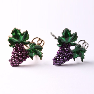 Elegant purple grape napkin rings with green leaves and metallic finish for table decor