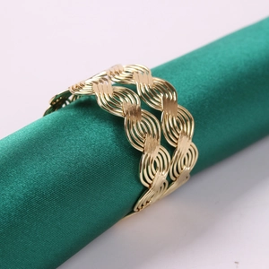 Golden wave woven napkin ring with champagne finish for upscale dining table decor