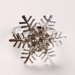 Detail of silver snowflake napkin ring with clear rhinestones for Christmas table decor