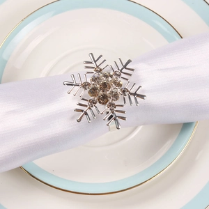 Silver snowflake napkin ring with champagne rhinestones for Christmas table setting