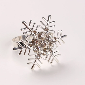Detailed view of silver snowflake napkin ring with sparkling crystal rhinestones