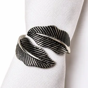 Detailed close-up of vintage silver leaf napkin ring with intricate vein textures
