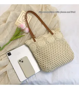Detail view of woven tote bag showing interior capacity with iPad and phone for scale