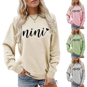 Detail view of cotton sweatshirt with nini script and heart print in four colors