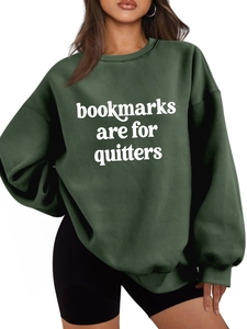Detail of dark green oversized sweatshirt with white Bookmarks Are For Quitters slogan
