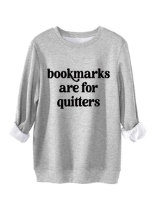 Close-up of light grey sweatshirt showing bookmarks are for quitters print and fleece lining