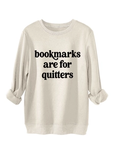 Detail of bookmarks are for quitters print on a thick beige crewneck sweatshirt