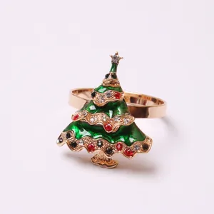 Close-up of green Christmas tree napkin ring with gold alloy finish and colorful crystals
