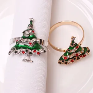 Detail of Christmas tree napkin rings with green enamel and sparkling rhinestones