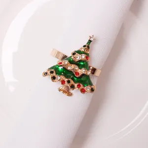 Detail of Christmas tree napkin ring with green enamel and colorful rhinestones