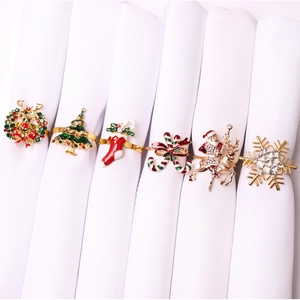Set of 6 Christmas napkin rings featuring snowflake, elk, and Santa Claus motifs