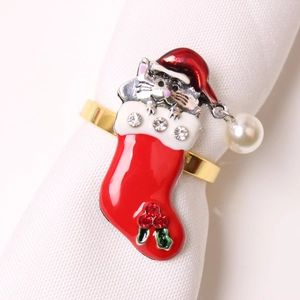 Macro view of Christmas cat in stocking napkin ring with rhinestones and pearl detail