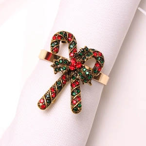Close-up of Christmas candy cane napkin ring with red and green rhinestones