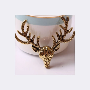 Retro golden stag head sculpture with detailed antlers for home decor display