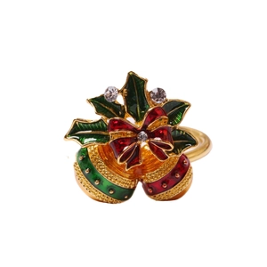 Christmas napkin ring with red and green enamel bells, bow, and sparkling crystals