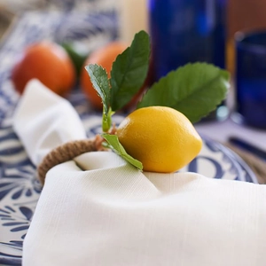 Mediterranean lemon napkin ring with jute rope and lifelike yellow fruit for table decor